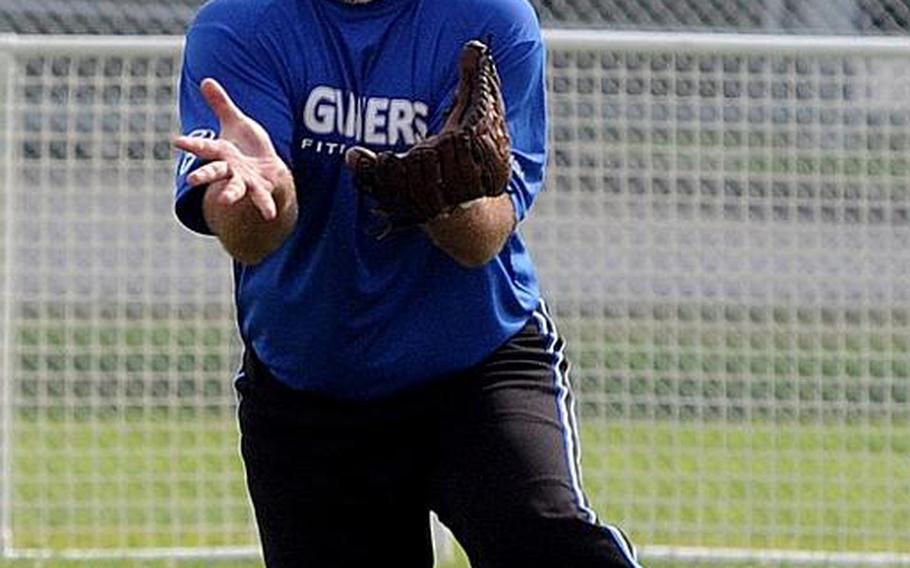 First Round/Last Round right fielder Eric Wagus tracks a fly ball by Daegu/Area IV of South Korea during knockout-round play in the 15th Firecracker Shootout Interservice Softball Tournament at Field 1, Gunners Fitness & Sports Complex, Camp Foster, Okinawa Sunday, July 4, 2010. First Round/Last Round of Okinawa eliminated Daegu/Area IV 7-6.