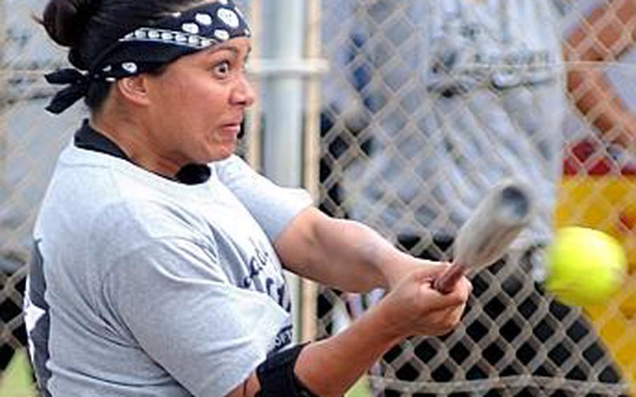 All-Army outfielder Veronica Bangi of the Camp Casey Lady Warriors makes contact against Camp Humphreys during the women&#39;s championship game in the 15th Firecracker Shootout Interservice Softball Tournament at Camp Foster, Okinawa on Monday, July 5. Casey beat Humphreys in an all-Korea final 23-3 in three innings.