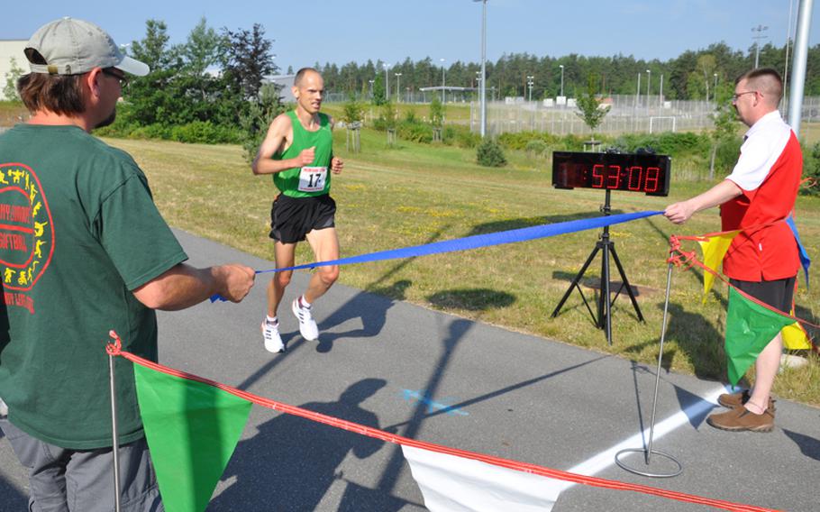 Maj. Keith Matiskella of Grafenwöhr nears the finish line of the U.S. Forces-Europe Army 10-Miler in record time. He finished in 53 minutes, 9 seconds to lead qualifiers for the Army 10-Miler in October.