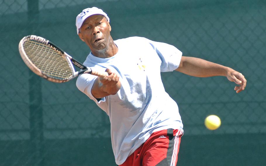 Terry Johnson sends a forehand back over the net in his men's open division final against Jorge Sepulveda at the U.S. Forces Europe tennis championships in Heidelberg, Germany, on Sunday. Johnson beat his doubles partner 6-3, 6-4.