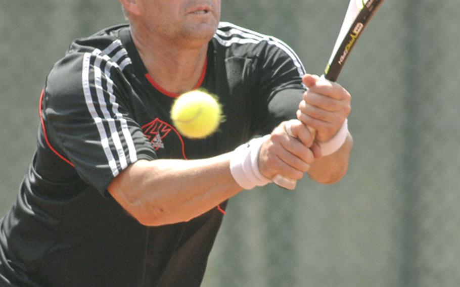 Metin Karaca returns a shot by Ralph Totorica in the men's masters final at the 2010 U.S. Forces Europe tennis championships in Heidelberg, Germany, on Sunday. Karaca won the match 2-6, 6-3, 6-1.