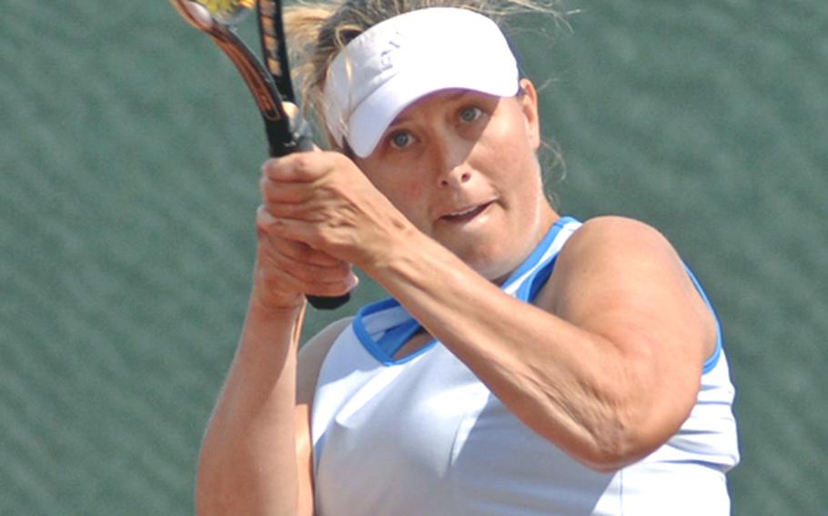 Cheryl Riise makes a two-handed return of a Maya Pardee shot in her 4-6, 4-6 loss to Pardee in the women's  open final at the U.S. Forces Europe tennis championships in Heidelberg, Germany, on Sunday.