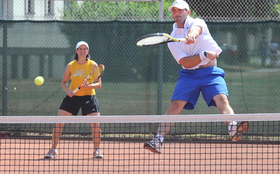 Tim Goss makes a leaping return in the mixed finals at the U.S. Forces Europe tennis championships in Heidelberg, Germany, on Suday. Goss teamed up with women's open champion Maya Pardee, left, to defeat Jackie Pitts and Chris Burr 6-2, 7-6 (7-3) in the final.




Michael Abrams/Stars and Stripes