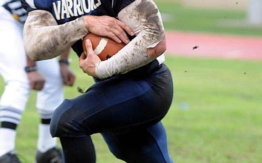 Yokota Warriors running back Kevin Fortin looks for daylight against Joint Task Force during Saturday&#39;s U.S. Forces Japan-American Football League Torii Bowl championship game at Bonk Field, Yokota High School, Yokota Air Base, Japan. Yokota won 26-23.