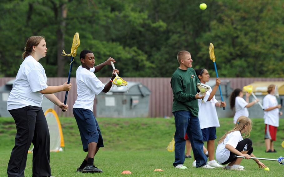 Lacrosse was an unfamiliar sport to many of the participants at the Mannheim Community?s one-day German-American sports camp at Benjamin Franklin Village and Sullivan Barracks. About 400 youngsters turned out for the camp on Friday that featured basketball, soccer, lacrosse, archery and American football workshops.