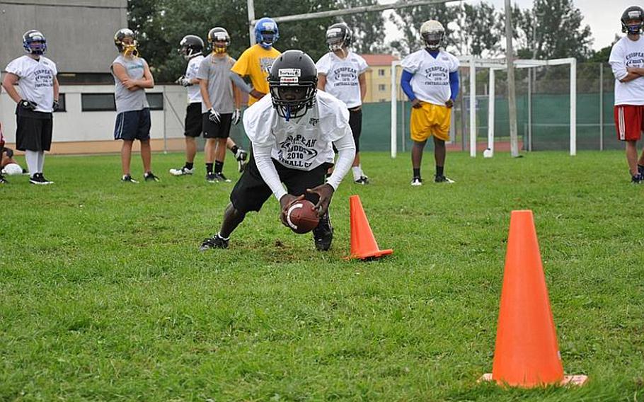 Charles Boateng, a junior from Hohenfels High School, turns the corner during a running-back drill Wednesday during an exercise Wednesday at the DODDS-Europe football camp in Ansbach, Germany.