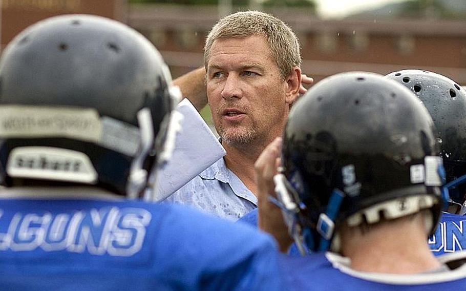 New head coach Billy Ratcliff addresses the troops during Wednesday&#39;s Seoul American Falcons football practice at Sims Field, Seoul American High School, South Post, Yongsan Garrison, South Korea.