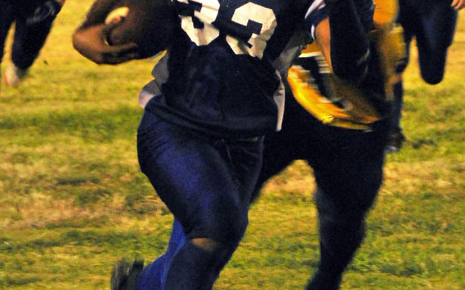 Yokota Panthers senior running back Devin Day breaks free for yards against the American School In Japan Mustangs during Friday's Kanto Plain Association of Secondary Schools football game at Bonk Field, Yokota High School, Yokota Air Base, Japan. Day rushed 25 times for 178 yards and five touchdowns as the Panthers routed the Mustangs 46-7.