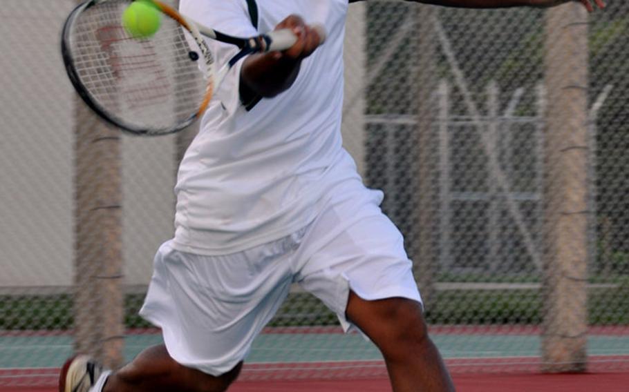 Kubasaki&#39;s Reej Buenaventura smacks a forehand volley against Kadena&#39;s Michael Potts during Tuesday&#39;s Okinawa Activities Council season-opening tennis tie at Kubasaki High School, Camp Foster, Okinawa. Buenaventura edged Potts 9-7, but Kadena&#39;s boys won the tie 5-2.