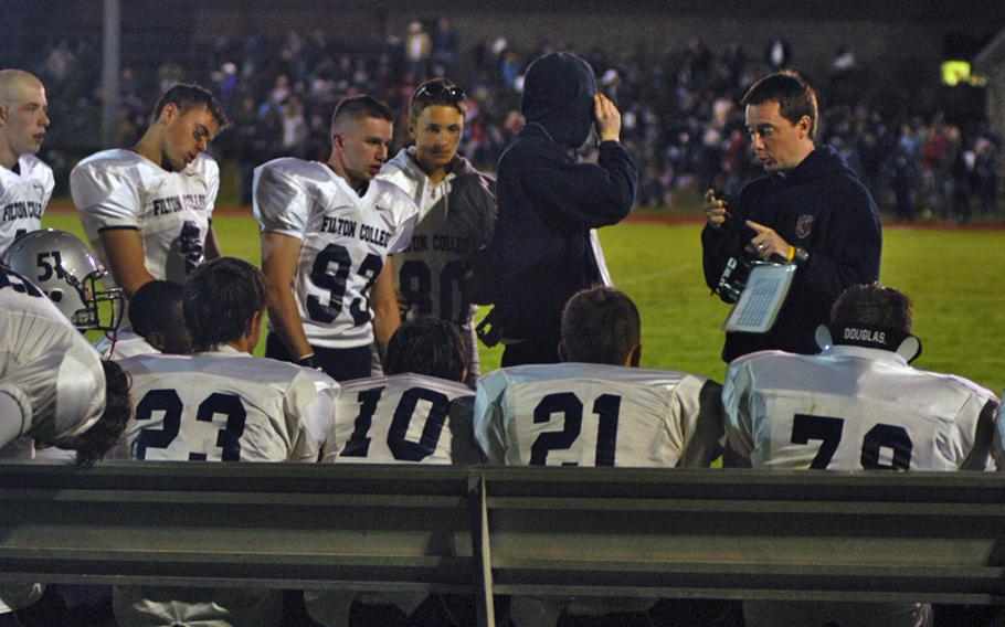 Filton Academy head coach Ben Herod speaks to his players at halftime during the Pride's 31-6 victory over Lakenheath on Friday night.