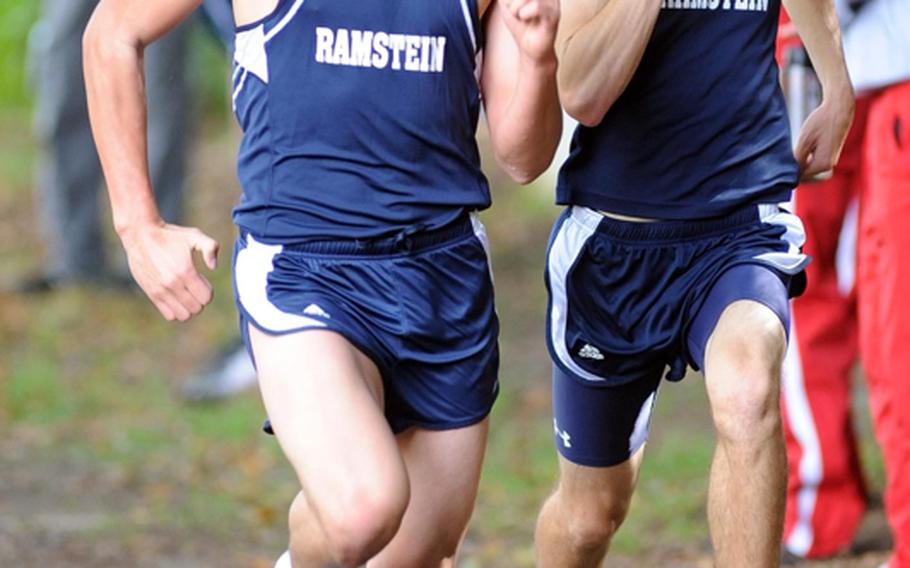 After 5,000 meters, the boys cross country race at Ramstein-Miesenbach ended in a dead heat between Ramstein&#39;s Thomas Amrine, left, and Carl Lewenhaupt. They won in 16 minutes 57.39 seconds, ahead of teammate Jack Scranton.