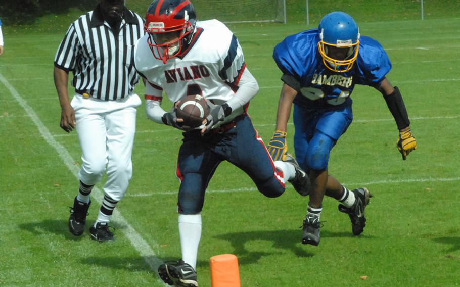 Aviano junior Corey Webb is knocked out of bounds by Bamberg&#39;s Tyler Lewis just before crossing the goal line Saturday in Schweinfurt during Bamberg&#39;s 26-20 win.