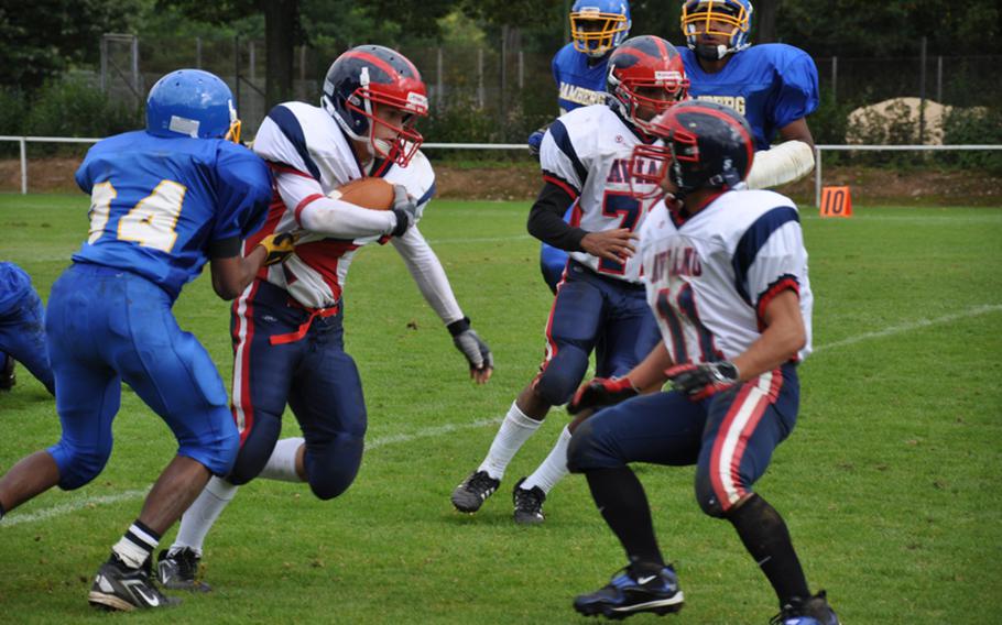 Aviano junior Corey Webb tries to break free from the Bamberg defense Saturday in Schweinfurt during Bamberg&#39;s 26-20  season-opening victory over visiting Aviano.