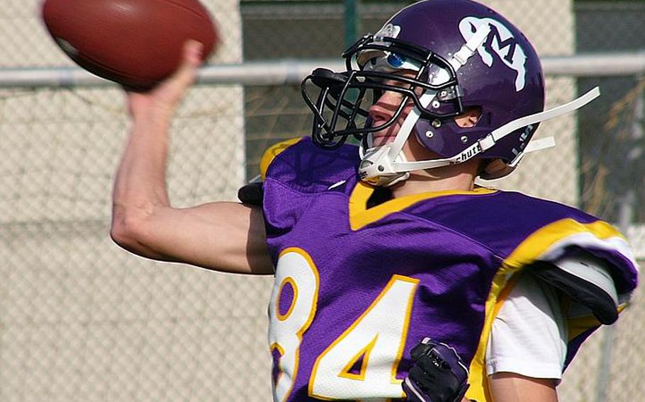 Preparing for just the second high school football game of his life, senior quarterback Adam Cornelius throws an out-route at a Monday practice session in Mannheim, Germany. In his first game, Cornelius piloted the Bison to a 28-8 road victory against SHAPE.