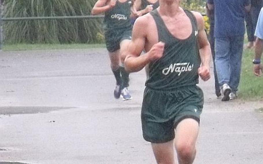 Naples High School's Ian Eversman posted a personal best of 16 minutes 57  seconds despite the foul weather at Saturday's cross country meet against Sigonella. Eversman won the race.