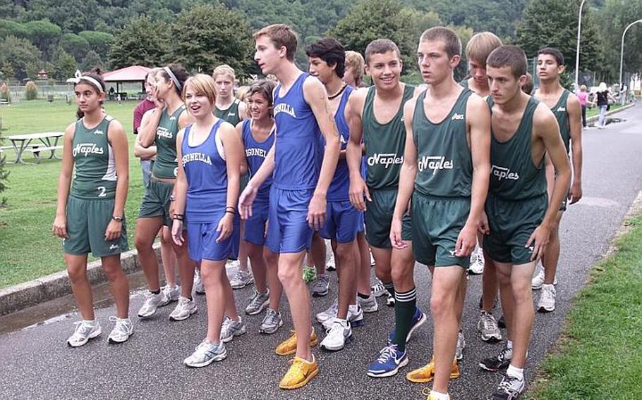 Boys and girls runners from Naples and Sigonella high schools line up together for the start of Saturday's  varsity meet. Naples was credited with wins for both the boys and girls because Sigonella did not have enough runners to fill out either team.