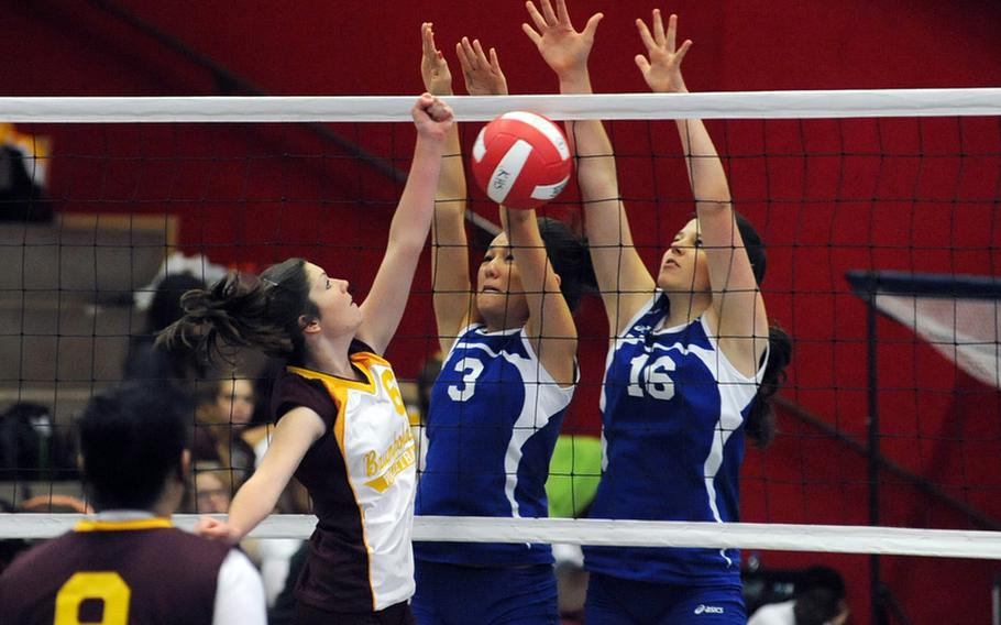 Wiesbadens Annette Hutzky, right,  and Michelle Schonberg block Baumholder's Laura Bailes, during their match in Kaiserslautern, Germany, on Saturday. Wiesbaden won 25-13, 25-10, 19-25, 25-17.