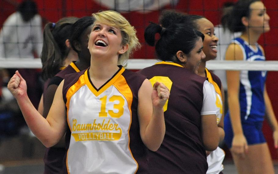 Baumholder's Alexandra Bower, foreground, and teammates celebrate taking the third game from Wiesbaden in their match in Kaiserslautern, Germany, on Saturday. Wiesbaden won 25-13, 25-10, 19-25, 25-17.