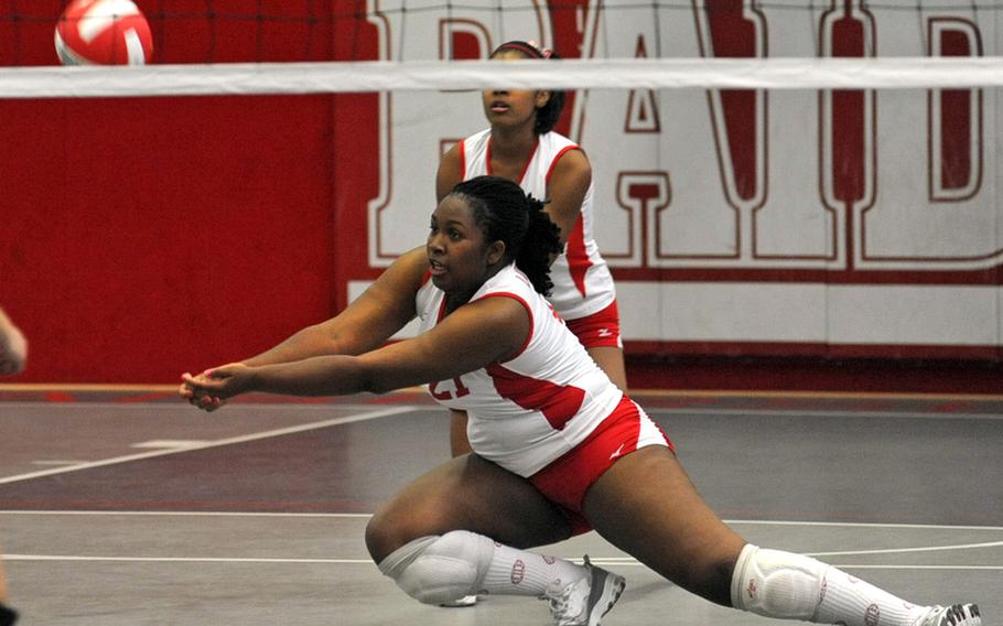 Kaiserslautern's Courtney Woods digs deep to return a SHAPE shot in a match in Kaiserslautern that SHAPE won 25-17, 25-6, 25-22