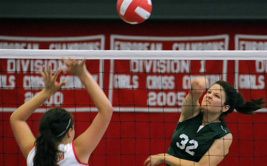 SHAPE's Liene Bauska slams the ball past Kaiserslautern's Liz Scher in SHAPE's  25-17, 25-6, 25-22 win over the Lady Raiders in Kaiserslautern on Saturday.