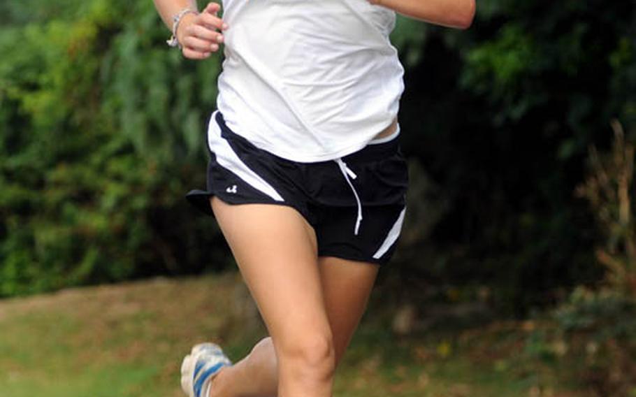 Kadena senior India Adams races toward the finish during Wednesday's Okinawa Activities Council cross-country meet at the 3.1-mile Habu Trail course on Marine Corps Air Station Futenma. Adams won in 20 minutes, 59 seconds.