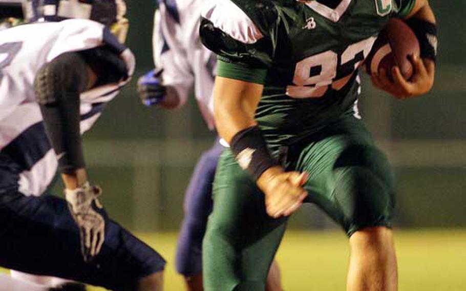Daegu American running back Jarel ''Tank'' Connie looks for running room against Seoul American's Antoine Daniels during Friday's DODDS Korea football game at Kelly Field, Camp Walker, South Korea. Daegu routed Seoul, 40-14.