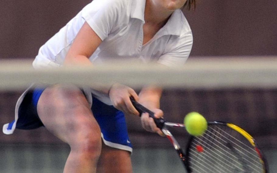 Wiesbaden's Kelsey Smith approaches the net to return a shot by Kaiserslautern's Mehgan Eaker during tennis action in Wiesbaden on Saturday. Eaker won the match 6-4, 6-2.