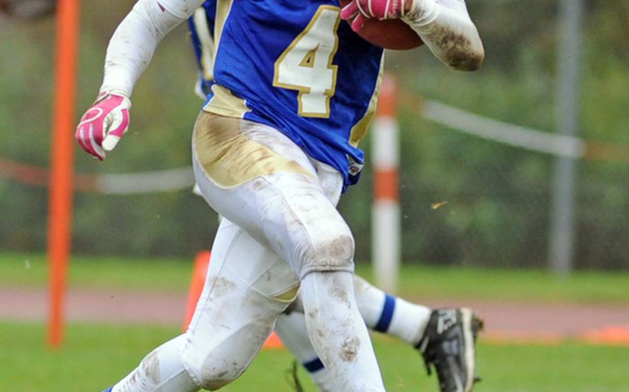 Wiesbaden's Daniel Harris scampers across the goal line to score one of his two touchdowns in the Warriors' 34-7 win over the visiting Vilseck  Falcons on Saturday.