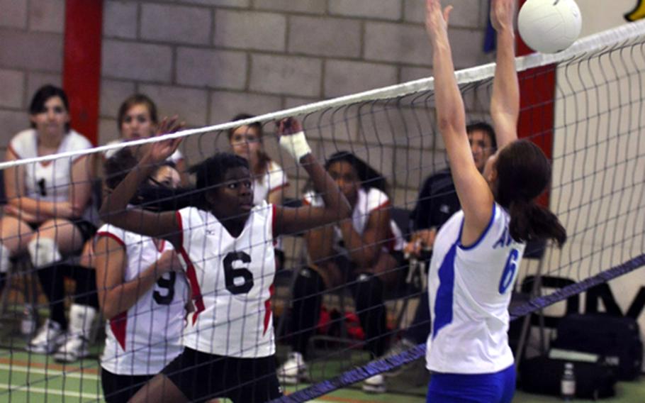Menwith Hill's Monique McCreary (left) sneaks the ball past Rota?s Michaela Texidor during a match at RAF Alconbury, England, Oct. 2.