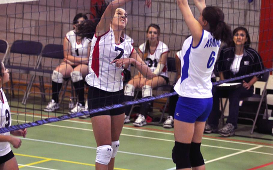 RAF ALCONBURY, England?Mustang player Kaia Pierce (left) sends a volley over the net past Admiral player Michaela Texidor during a game between Menwith Hill and Rota. Rota went undefeated in four games at RAF Alconbury.