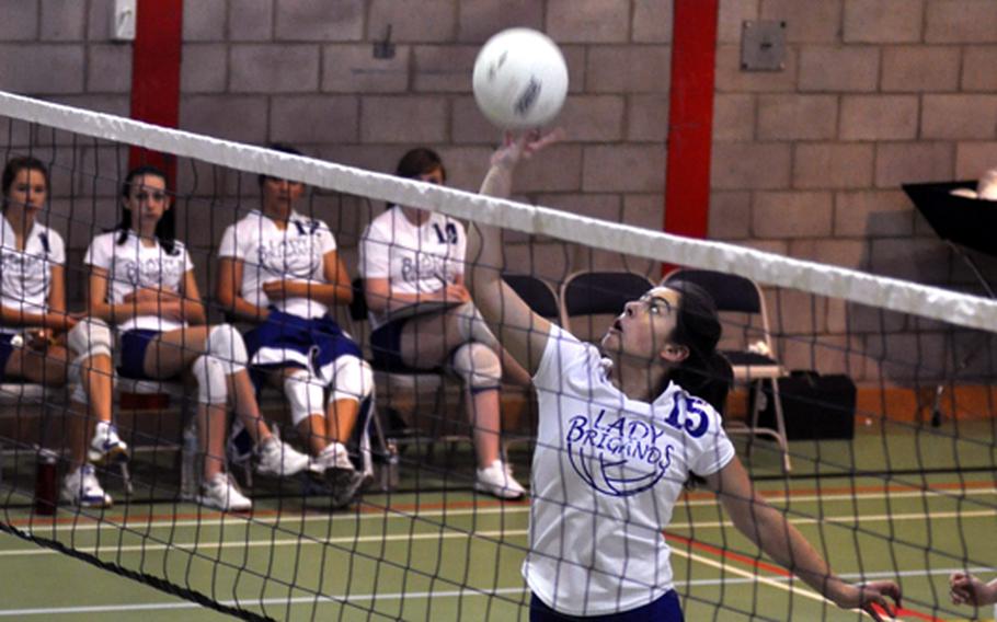 Brussels' Ana-Marija Vasileva slaps the ball across the net during a match against the Menwith Hill Mustangs. The Brigands were victorious against the Mustangs.