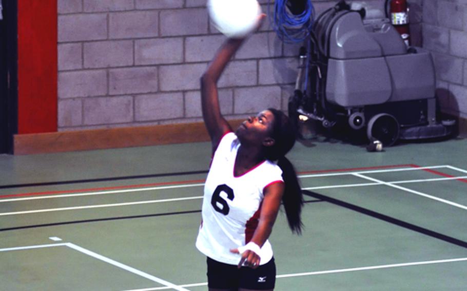 Menwith Hill?s Monique McCreary serves the volleyball during a doubleheader at RAF Alconbury, England on Oct. 2.
