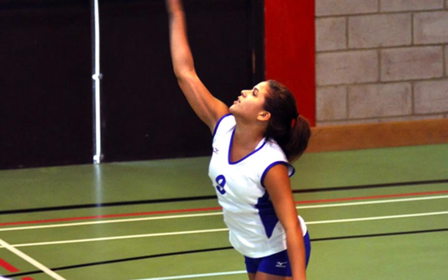 Rota's Ashley Stedge serves the volleyball during a match against the Menwith Hill Mustangs.
