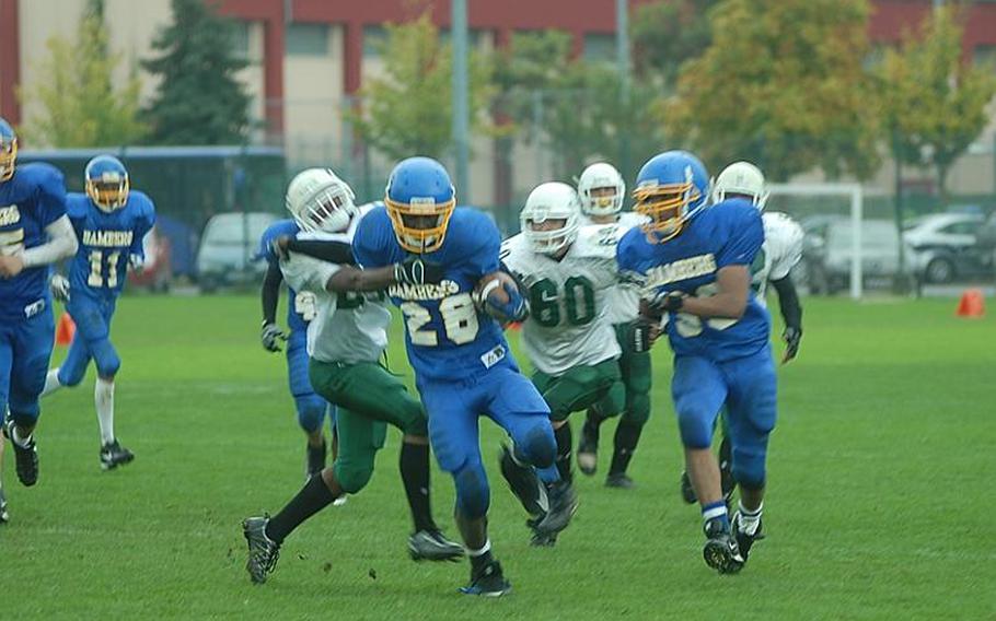 Bamberg senior running back Javonte Knuckles tries to break free of the Naples defense Saturday in Bamberg';s come-from-behind 26-21 win over visiting Naples. Knuckles rushed for 305 yards on 20 carries and scored two touchdowns as Bamberg remained undefeated in Division II-South.