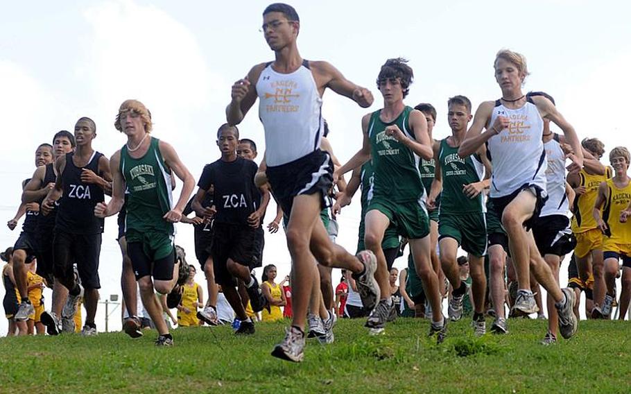 Senior Tomas Sanchez of Kadena High School leads the pack at the start of the Sept. 29 Okinawa Activities Council cross country race at the 3.1-mile Habu Trail course on Marine Corps Air Station Futenma. Sanchez has a sister, Seira, who ran exhibition out of Ryukyu Middle School last year as a seventh grader. DODDS rules have changed since then. Now, middle-school wrestlers, runners, tennis players and track athletes may only practice, not compete even as exhibition with high school teams.