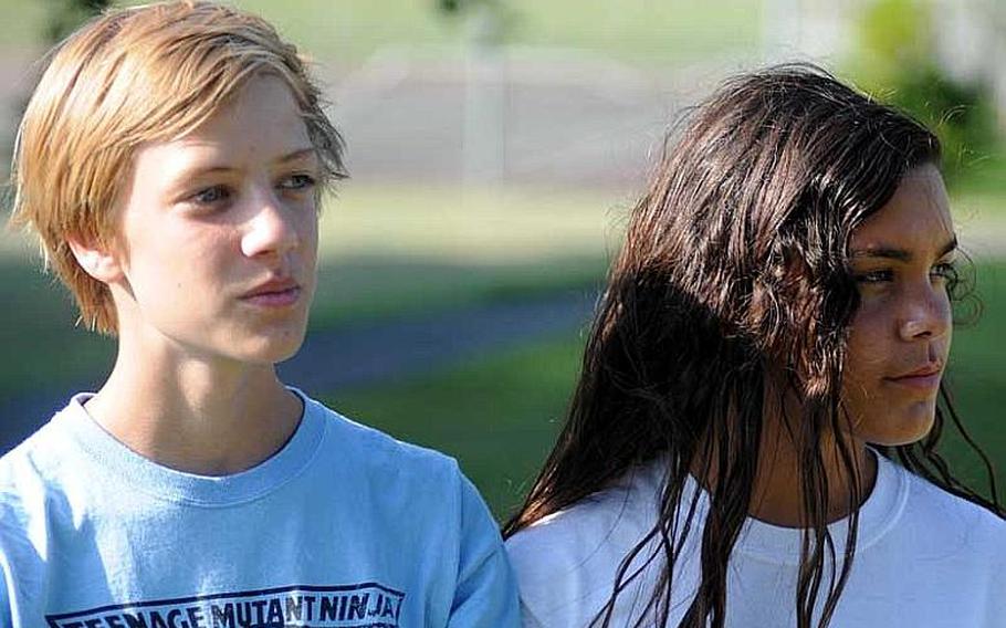 Eighth-graders Sam Bishop of Kadena Middle School and Seira Sanchez of Ryukyu Middle School used to be eligible to run in Okinawa Activities Council cross country meets as exhibition, non-scoring, non-medaling entrants. Now, because of a rule allowing them to only practice but not participate in meets, middle schoolers such as they can only watch from the sideline.