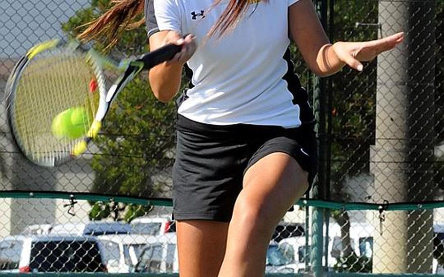 Kadena sophomore Erika Youngdahl slaps a forehand return against Kubasaki senior Tammi Ragan during Tuesday's Okinawa Activities Council tennis tie at Risner Tennis Complex, Kadena Air Base, Okinawa. Youngdahl beat Ragan 6-3, 6-1, then teamed with senior Christin Gentz to beat Ragan and Monica Saldana 6-3, 6-0 to remain unbeaten in singles and doubles on the OAC season.