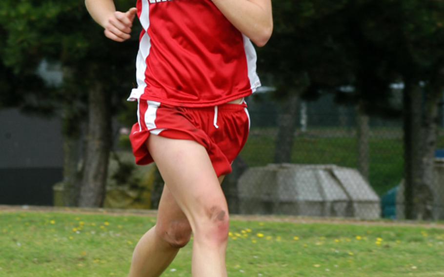 Lakenheath senior Elizabeth Doe competes in a cross country race on the Lancers' home course. She finished in first place with a time of 20 minutes, 17 seconds after a hard fall during the start of the race. 