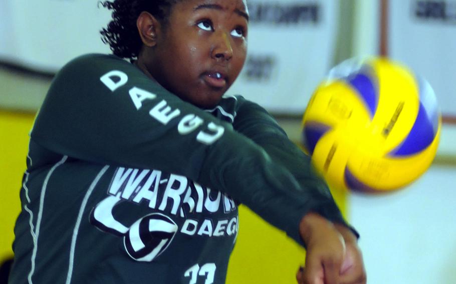 Maleah Potts-Cash of Daegu American receives a Kubasaki serve during Saturday's matches in the 1st Kadena Invitational Girls Volleyball Tournament at Panther Pit, Kadena High School, Kadena Air Base, Okinawa. Defending Far East Division II Tournament champion Daegu lost to Kubasaki 22-25, 25-9, 15-12, then lost to Shuri Higashi 25-13, 14-25, 15-12 before sweeping Okinawa Christian International 25-13, 25-10 to go 3-3 after two days of play in the three-day tournament. Shuri Higashi was 6-0 and Kubasaki 3-2.