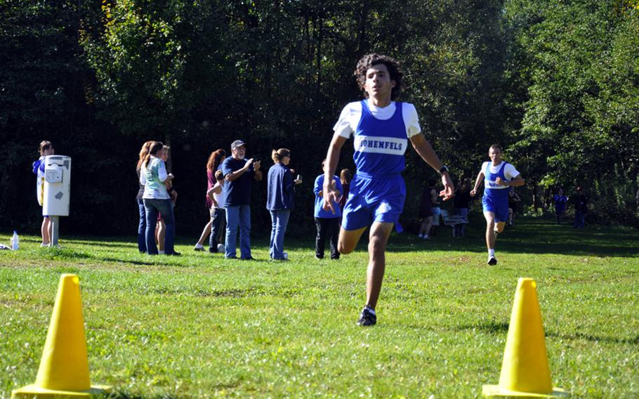 Hohenfels' Drew Martin crosses the finish line first Saturday in Bamberg with a time of 19 minutes, 10 seconds. Dan Cochran finished three seconds behind Martin for second place.