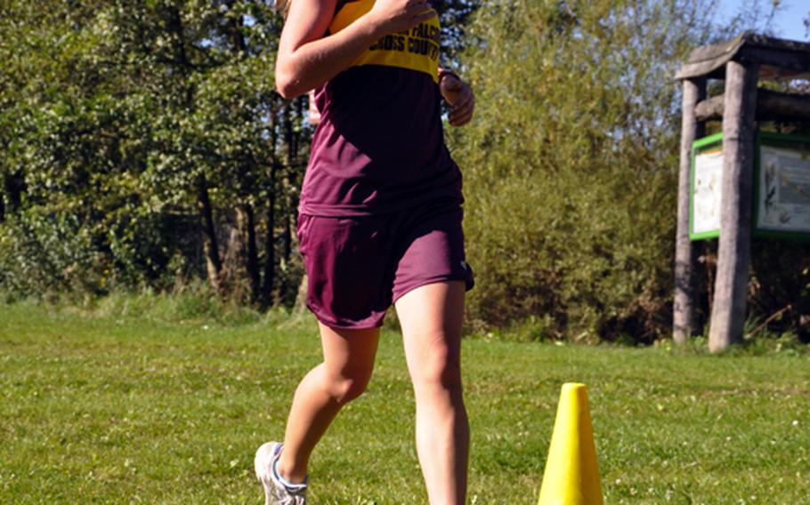 Malia Carson, a sophomore from Vilseck, crosses the finish line Saturday in 22 minutes, 9 seconds - good for second place in the cross country meet at Bamberg.
