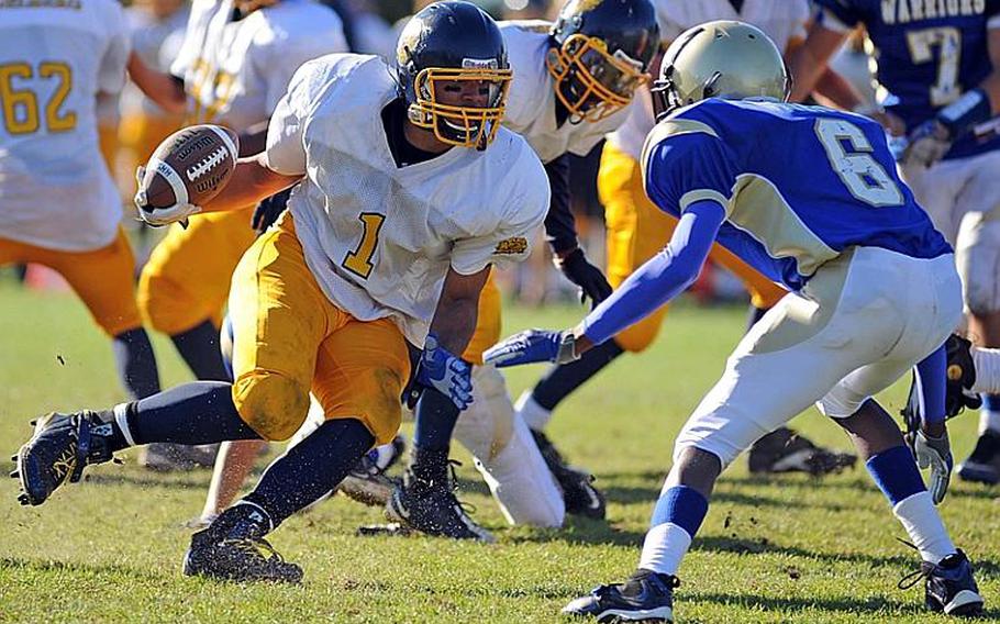 Heidelberg's Chris Cuthbert, left, looks Wiesbaden's Khari Bennett in the eyes as he picks up yardage in Heidelberg's 54-19 win against the Warriors, in a game that saw the clock running much of the fourth quarter. Cuthbert finished the game with four touchdowns.