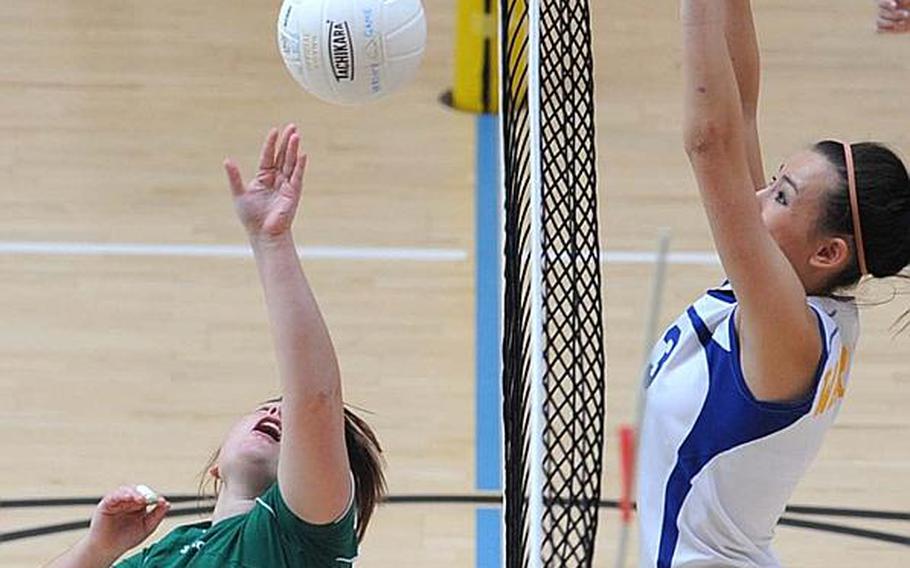 AFNORTH's Kassandra Thomas-Tremblay, left, and Wiesbaden's Michelle Schonberg contest a ball at the net during their match in Wiesbaden, on Saturday. Wiesbaden won, 25-15, 25-14, 28-26.