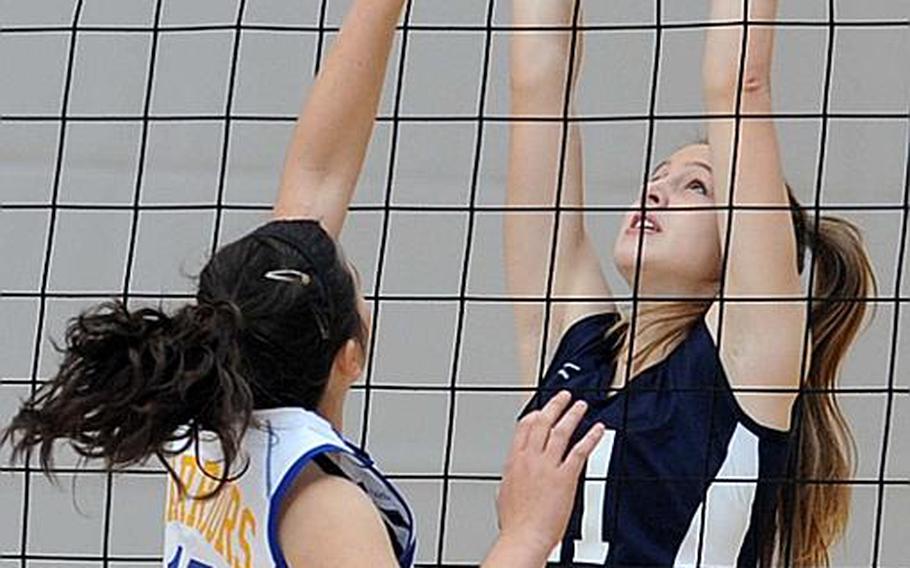 Bitburg's Melissa Menschel, right, attempts to knock the ball back over the net against Wiesbaden's Annette Hutzky. Wiesbaden beat Bitburg at home, 25-16, 25-14, 25-13, on Saturday.