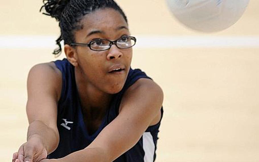 Bitburg's Dalasha Bizzell keeps her eyes on the ball as she returns a Wiesbaden shot during their match in Wiesbaden on Saturday. The Warriors beat Bitburg, 25-16, 25-14, 25-13.