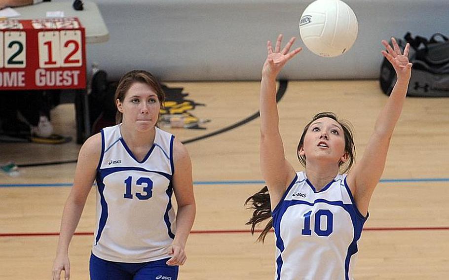Wiesbaden's Andrea Arnold, right, sets the ball for a teammate, as Kirsten Velsvaag watches. Wiesbaden won both its homecoming matches on Saturday, 25-16, 25-14, 25-13 against Bitburg and 25-15, 25-14, 28-26 against AFNORTH.