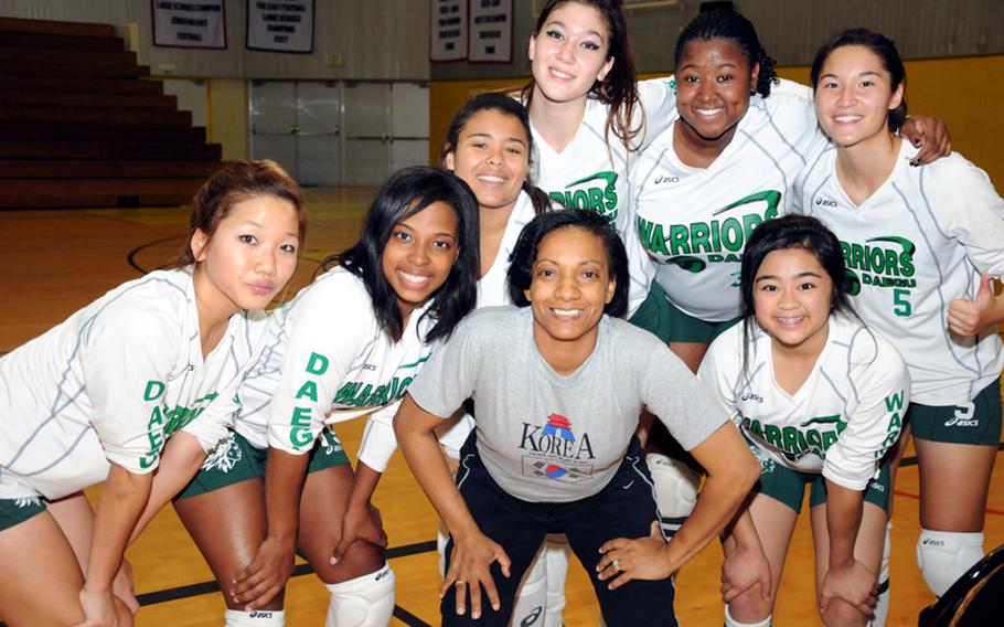 Defending Far East Girls Division II Volleyball Tournament champion Daegu American Warriors, clockwise from left: Senior setter Gulee Kwon, senior outside hitter Desiree Johnson, junior defender Destinee Post, senior middle blocker Kristina Bergman, junior middle blocker Maleah Potts-Cash, senior setter Angie Robinet, junior setter/outside hitter Leanne Quizon and coach Joanna Wyche.