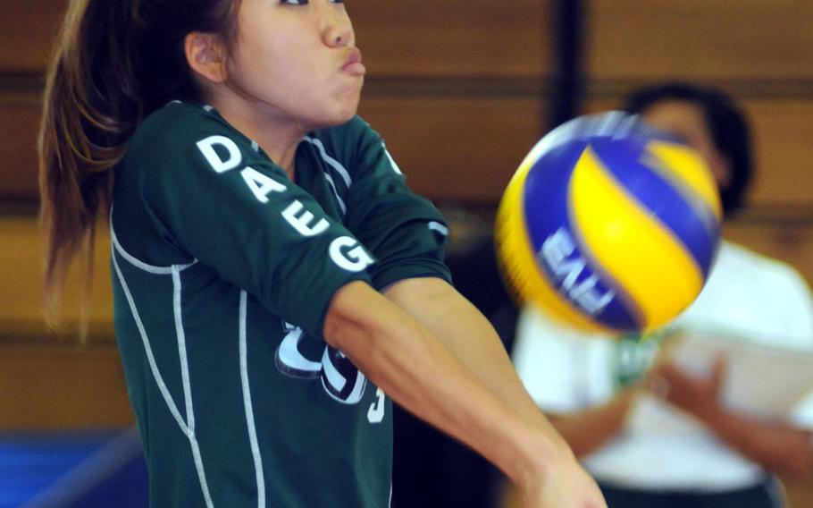 Daegu American Warriors senior setter Gulee Kwon receives a Kadena serve during Sunday's last match of the first Kadena Invitational Girls Volleyball Tournament at Panther Pit, Kadena High School, Kadena Air Base, Okinawa. Kwon is one of three players, the others senior setter Angie Robinet and middle blocker Kristina Bergman, who have started for four seasons for Daegu as ''home-grown'' products.