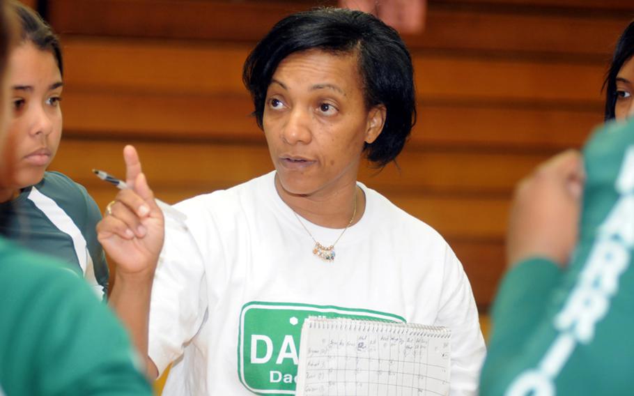 Daegu American Warriors coach Joanna Wyche makes a point during a timeout during Sunday's last match of the first Kadena Invitational Girls Volleyball Tournament at Panther Pit, Kadena High School, Kadena Air Base, Okinawa. Wyche is in her third year coaching a varsity team blessed with the presence of a core of seniors, middle blocker Kristina Bergman and setters Angie Robinet and Gulee Kwon, who have started for four seasons for Daegu as "home-grown" products.