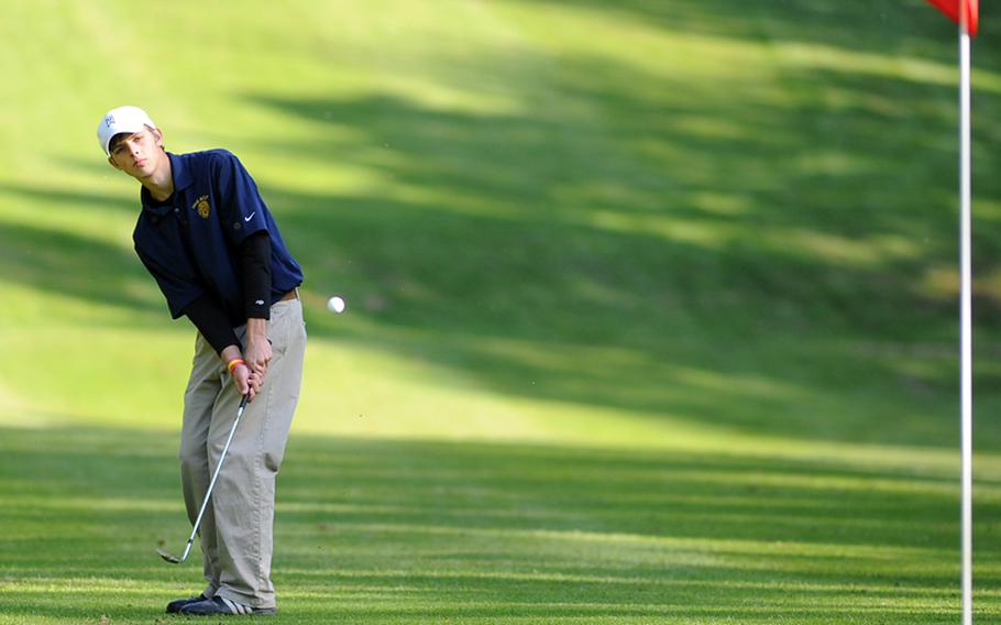 Mike Baltich of Heidelberg chips to the pin on opening day of the DODDS-Europe golf championships at Wiesbaden&#39;s Rheinblick golf course on Thursday.